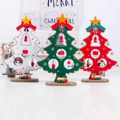 China New Design 3 Styles Wholesale Christmas Tree Decoration Wooden Rotating Christmas Tree Stand for sale