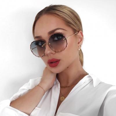 China Fashional Diamond Cut Round Flower Sun Glasses Fashion Rimless Women Sunglasses UV400 CE UV400 High Quality Unisex Gradient Sun Glasses Glasses for sale