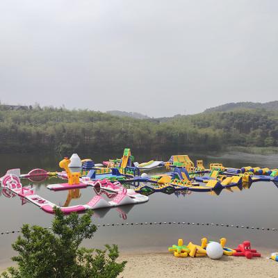 China Paddling Sport New Floating Inflatable Water Park Lake Inflatable Water Games The Sea Child Colorful Inflatable Water Park for Sale for sale