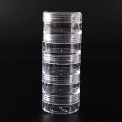 China Recyclable Gift 5 Slots 5G Shape Travel Promotional Cylindrical Transparent Weekly Pill Box Plastic Medicine for sale