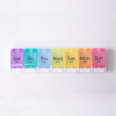 China 7 Days Push Button Daily Wholesale Design Large Capacity Plastic Portable Reminder Travel Pill Box for sale