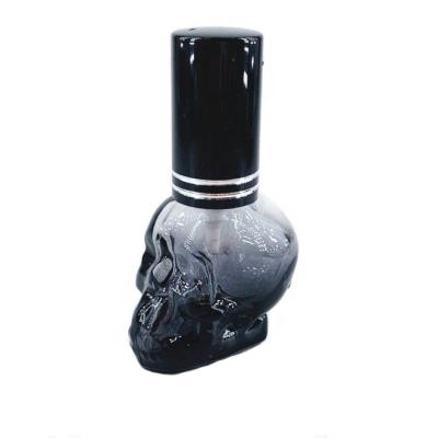 China Stock Wholesale Colorful Empty 3ml 5ml 7ml Skull Shape Perfume Glass Spray Bottles With Pump for sale