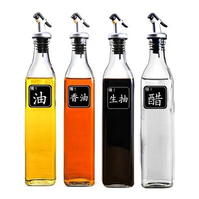 China Eco-freindly 250ml 500ml 1000ml square clear shape glass oil bottle cooking olive oil glass bottles with lids for sale