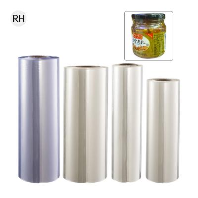 China Beverage Sleeve Printing PVC For Neck Seal And Label Printing Clear Plastic Film Packaging Film Heat Shrinkable Flexible Packaging for sale