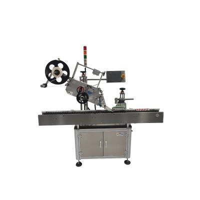 China Automatic horizontal food sticker label applicator machine for round tube bottle plastic labeling machine for sale