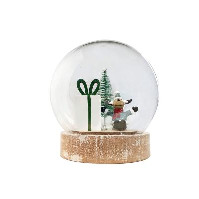 China Folk Art Xmas Santa Decorative Reindeer Plastic Snow Globes With Wooden Base for sale