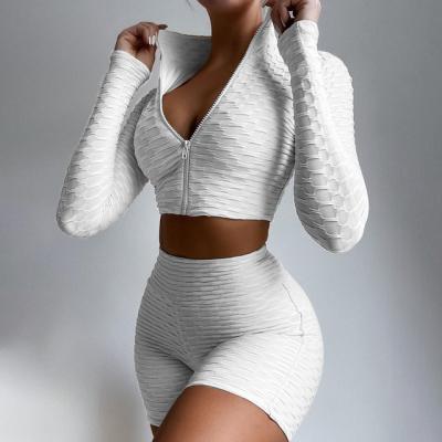 China 2021 breathable new solid color long sleeve yoga set tight fitting gym wear sports pineapple grid casual suit for sale