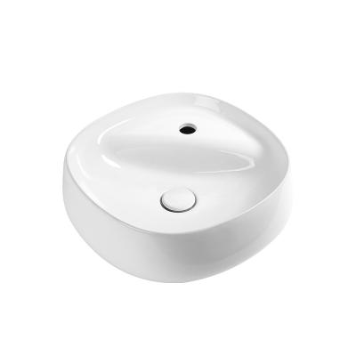 China Modern Table Top Single Hole Bathroom Faucet Single Bowl Sink Small Oval Ceramic Wash Basin for sale