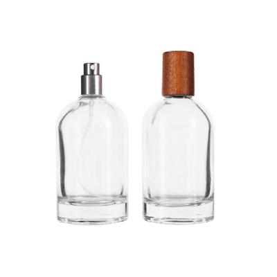 China 100ML Cosmetic Empty Perfume Bottles Round Bayonet Mouth Perfume Bottle Glass Perfume Bottle Packaging With Bamboo Wooden Lid for sale