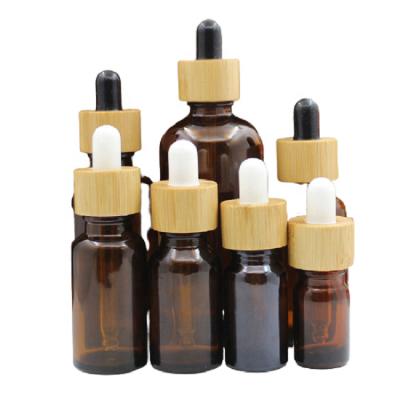 China Personal Care Products 5ml~100ml Glass Dropper Pipette Bottles Bright Amber Bamboo Wooden Lid Aromatherapy Refill Essential Oil Liquid Dropper Bottle for sale