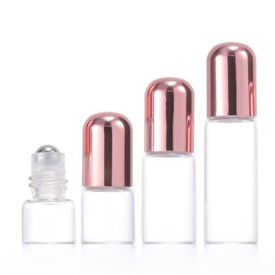 China Steel Roller Bead Roll On Rose Gold Empty Round Steel Roller Bottle 1ML 2ML 3ML 5ML 10ML Rose Essential Oil Glass Bottle Rose Gold Lid Perfume Packaging for sale