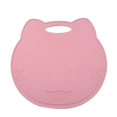 China Viable in Running Wheat Funny Straw Shape Cat Protective Food Plastic Pink Chopping Cutting Board with Built-in Garlic Crusher for sale