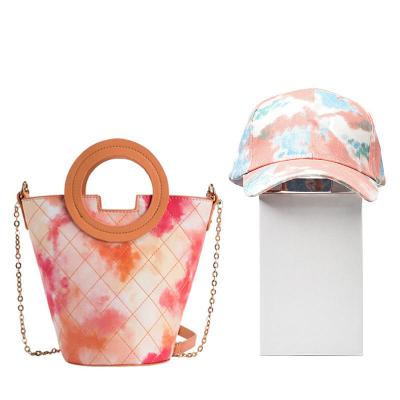 China Fashion bucket bag 2022 camouflage color ladies handbag set PU bag bucket bag and hat set made in China for sale