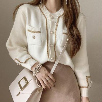 China 2021 spring ladies fashion retro pearl button cardigan sweater coat gold silk splicing round neck breathable knitted sweater women for sale