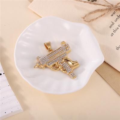 China Trendy Hiphop Fashion Stainless Steel Jewelry Iced Out 18K Gold Plated Gun Shape Creative Stylish Pendant for sale