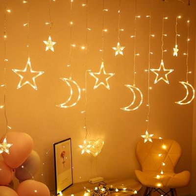 China Customizable Chirstmas Decor Plug-in Powered Fairy Lights Star And Moon Shape Curtain Lights for sale