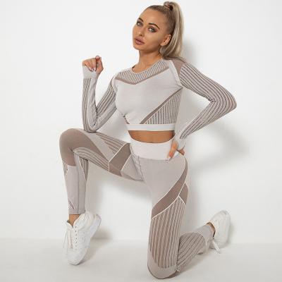 China 2022 Breathable Hollow Seamless Sweat-Wicking Yoga Sports Suit Long Sleeve Fitness Running Yoga Set for sale