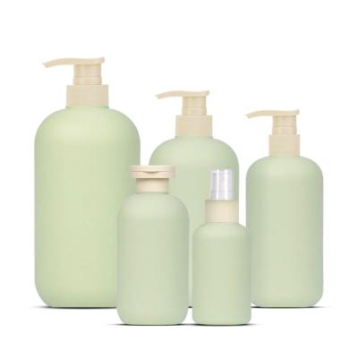 China Green HDPE Cosmetic Refillable Plastic Boston Round Bottle Dispenser For Shampoo, Lotion, Bathroom Cosmetic Packaging Container for sale