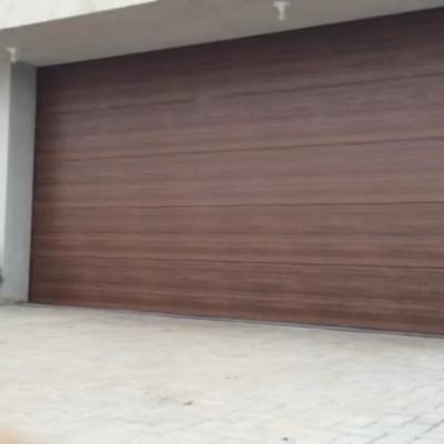 China Anti Theft Wooden Look 9x8 Sandwich Panel Galvanized Steel Insulated Sectional Garage Door for sale