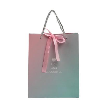 China Square Recyclable Luxury Retail White Colorful Printed Cartoon Recycled Design Custom Craft Cardboard Gift Paper Bag With Rope Handle Bow for sale