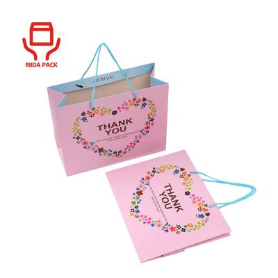 China Eco-friendly Recyclable Christmas Kraft Paper Gift Bag With Your Own Logo Printing Craft Paper Custom Suitcase for sale