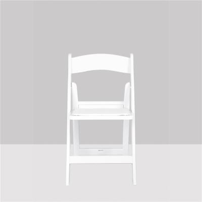 China Recyclable Wholesale Outdoor Wedding Event Banquet PU Cushion White Plastic Folding Chair for sale