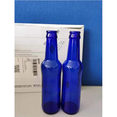 China Professional Wine Wholesale Custom Design Cobalt Blue Clear Glass Beer Bottle for sale