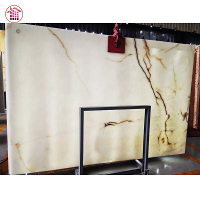 China Modern Ice White Onyx Price Slab Marble Tile Onyx Agate Natural Stone for sale