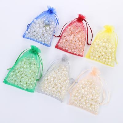 China Custom Drawstring Newcomer Gift Bags With Drawstring Mini Wedding Gift Bags Organza Gift Bags 7*9Cm Candy Pouches for sale