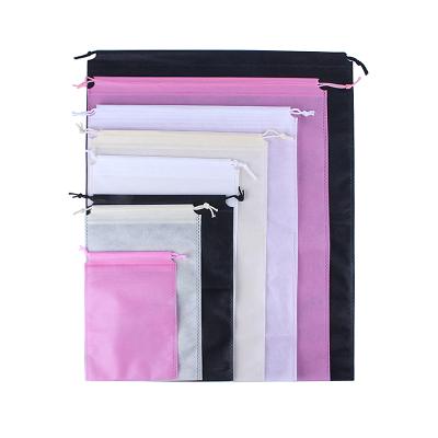 China Fashion Ebay Stock 35*45CM Gloves Gift Ice Cleat Nonwoven Drawstring Bags Pink Black Beige for sale