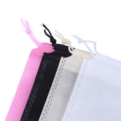 China Fashion Stock Factory 25*36CM Clothing Gift Ice Spike Drawstring Nonwoven Bags Nonwoven Pink Black Beige for sale