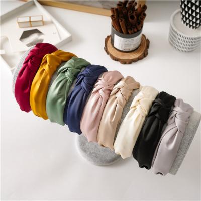 China Custom made elegant top hair knotted girls silk white headbands luxury twist rug fashion logo knot women's satin headbands for women for sale