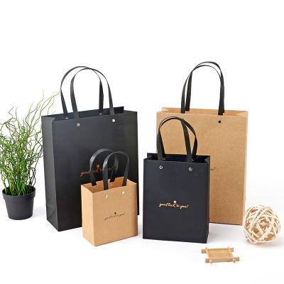 China Fashion Recyclable High Quality Custom Paper Kraft Paper Bag Luxury Gift With Rivet Paper Rope for sale