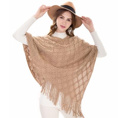 China Soft touch feeling winter lady thick wraps and shawls 100% acrylic fluffy tassel trocpt kmotted poncho for sale