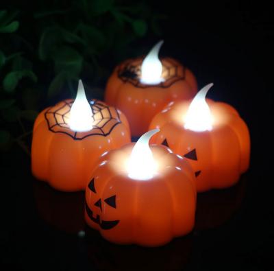 China Creative 12pcs Halloween LED Pumpkin Candle Light Stage Night Light Party Decoration Flameless Props for sale