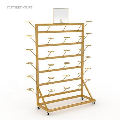 China Eco - Friendly Promotional Gold Metal Hat Wall Mounted Display Stand For Retail Store for sale