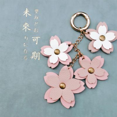 China Luxury Handmade Genuine Leather Key Chain Lady Bag Cherry Blossoms Big Brand Designer Luxury Korean Version Roman Bag Dangle Bag for sale