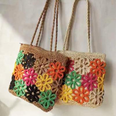 China Summer Vacation Chic Hollow Carved Raffia Straw Beach Tote Bag for Women All Seasons for sale