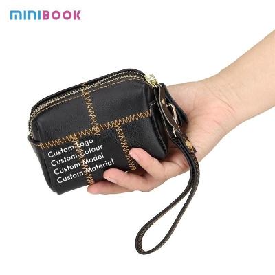 China Zipper Hasp Closure Small Women's Genuine Leather Keychain Pouch with Creative Purse for sale