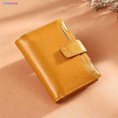 China Minibook Oil Wax Leather Vintage Wallet for Women Short Genuine Leather Coin Purse for sale