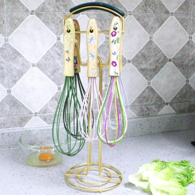 China Viable Color Patterned Wooden Handle Silicone Manual Egg Beater Egg Beater For Cooking Mixing Beating Beating Stirring for sale