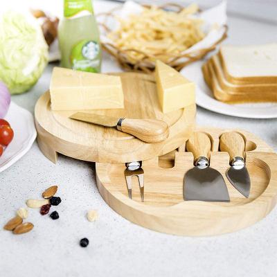 China Portable Professional 100% Natural Wood Handle Viable 4 Piece Cheese Knives Set With Round Cheese Board Set For Gift for sale