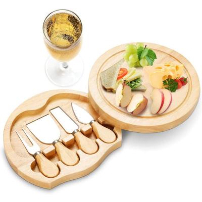 China Sustainable Unique Wooden Cheese Cutting Board Cheese Knife Set Round Cheese Board With 4 Pieces for sale