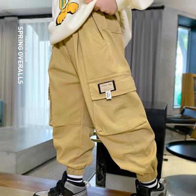 China Anti-wrinkle clearance fashion cargo pants for teens boys khaki trousers for sale