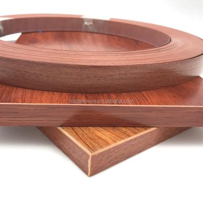 China Traditional Fancy Side Joint Face Joint Wood Grain PVC Furniture Trims Side Decorative Strip Joint Strip for sale