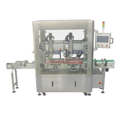 China Automatic Beverage Guangzhou Factory Price Two Heads Tracking Type Servo Twist Bottle Screw Capping Machine With Driving for sale