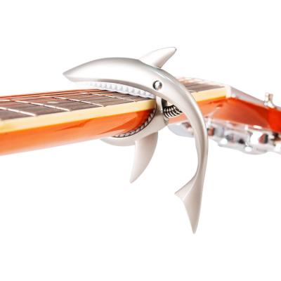 China Acoustic Guitar Luxury Matte Classical Capo Paint Alloy Shark Shape Adjustable Capo for sale