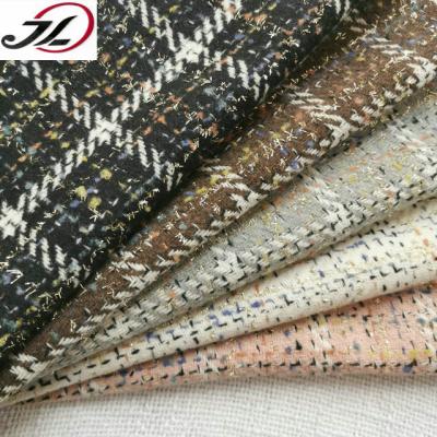 China New viable polyesters yarn dyed fancy yarn tweed yarn bon woolen fabric for coat for sale