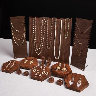 China Customized Customized Modern OEM Store Jewelry Display Set PU Background Table Jewelry Leather Luxury Wood Display Stand for sale