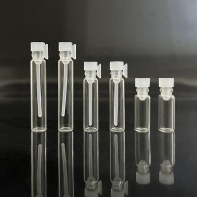 China Refillable Stock 0.5ml 1ml 2ml clear perfume sample vial small glass bottle with plastic stopper for sale